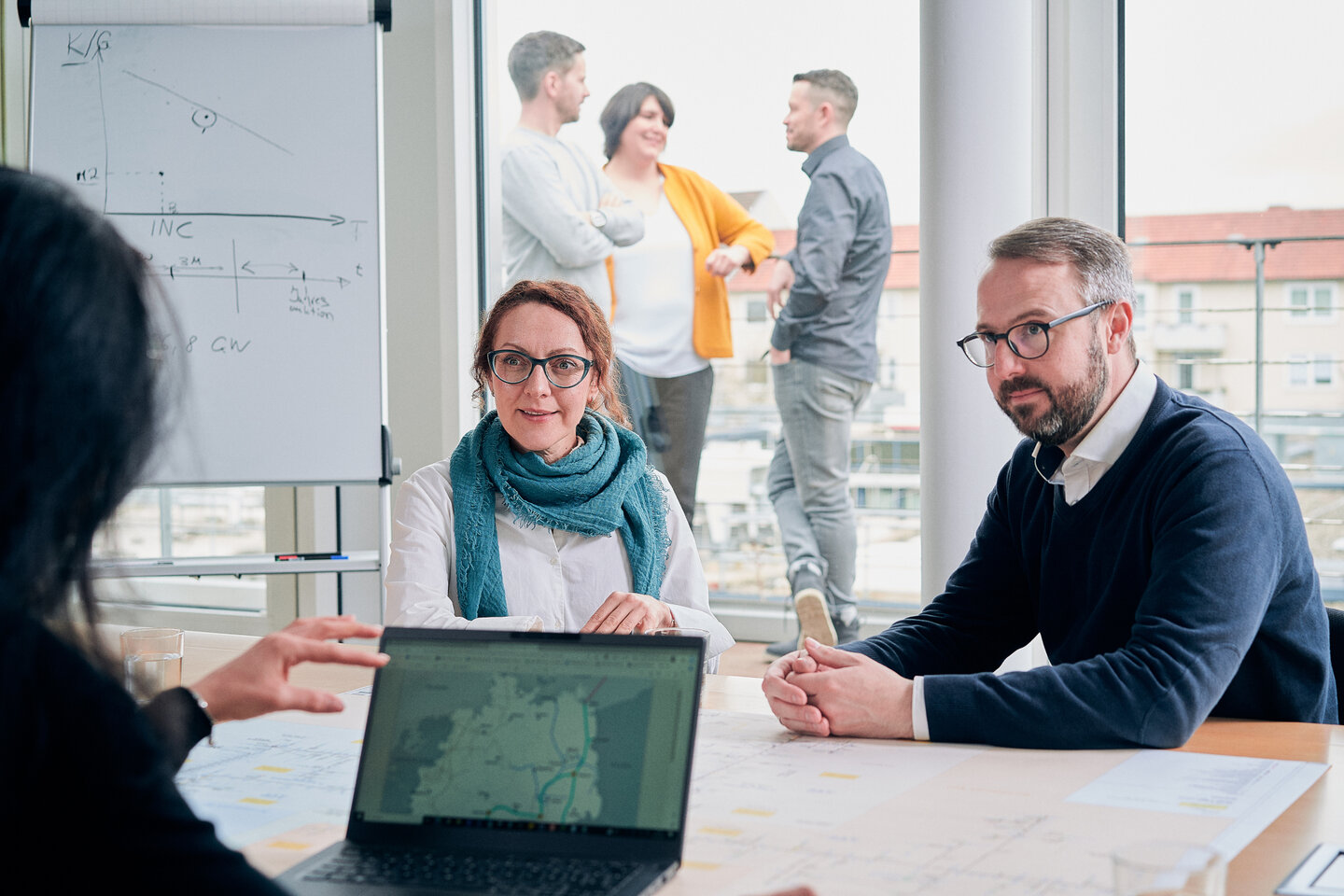 Colleagues talking about network connections