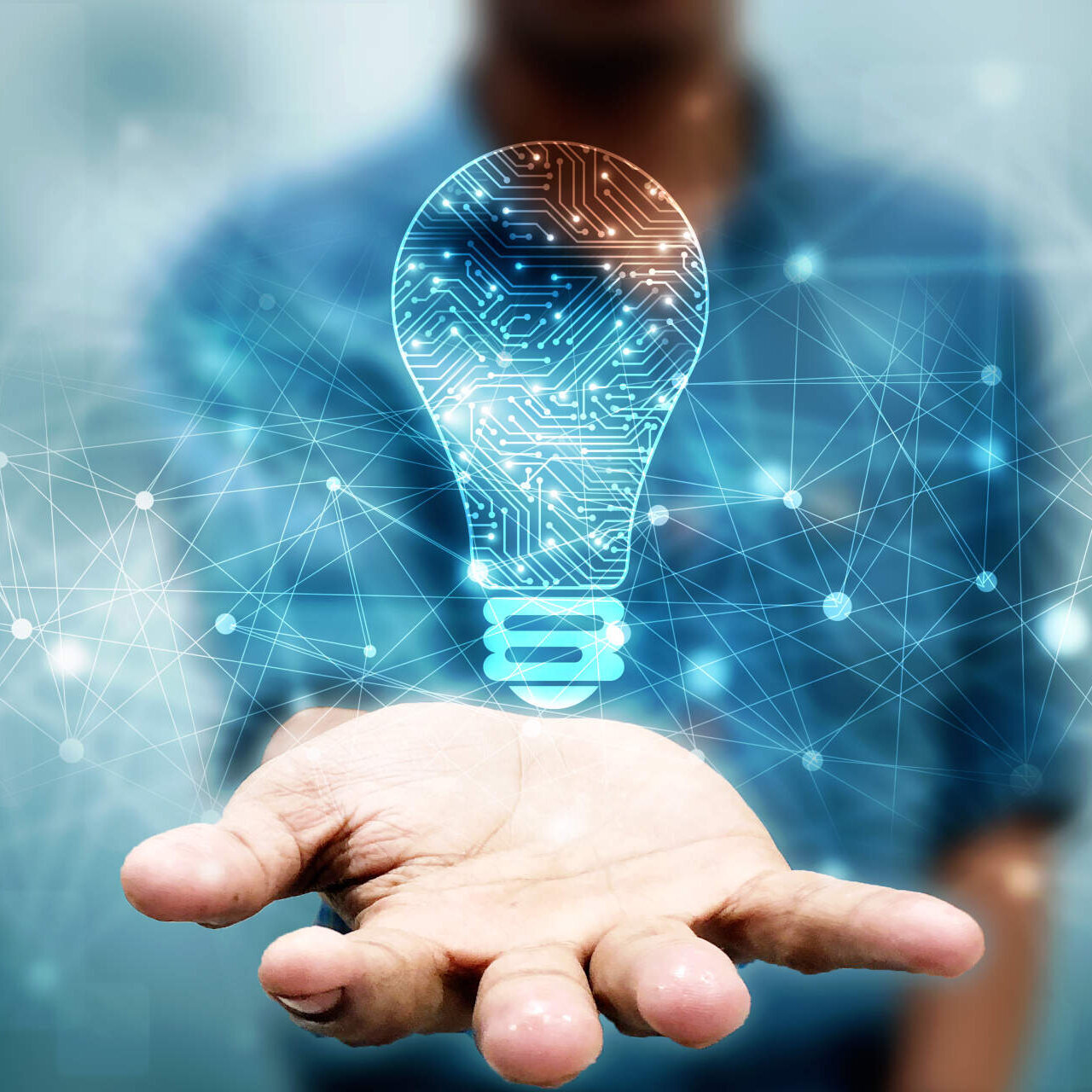 Innovative person with light bulb in hand